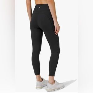 Lululemon Invigorate Black High Rise pant 25 inch with pockets, size 6.